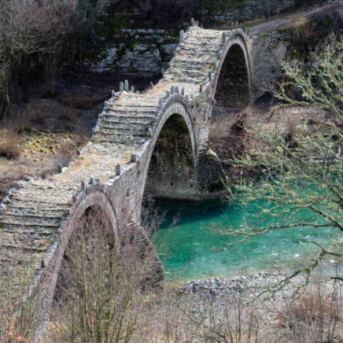 View of the traditional stone Kalogeriko or Plakida  Bridge in Zagori of Epirus, Greece in Autumn